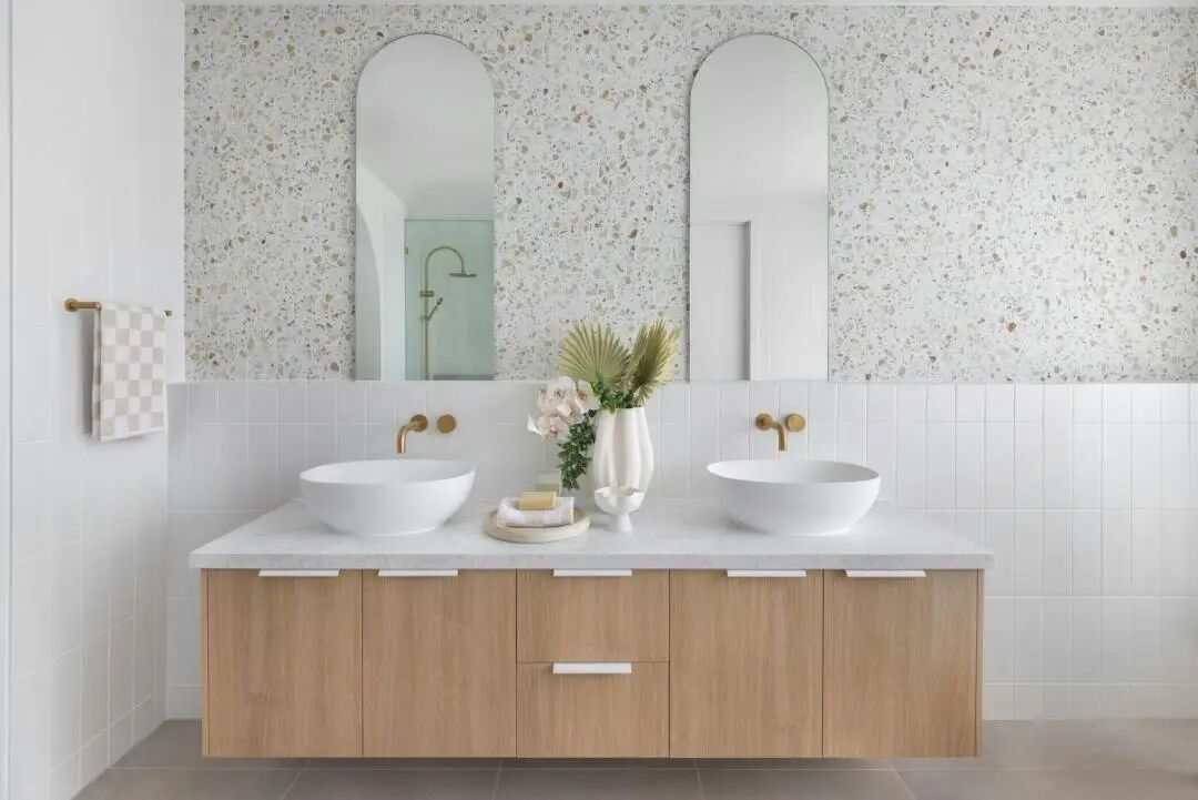 Modern minimalist bathroom with freestanding tub, wood accents, and soft natural lighting for wellness design
