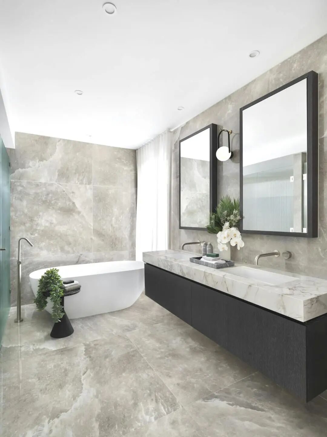 Modern bathroom design with freestanding tub and natural light for 2026 wellness-focused interior trends